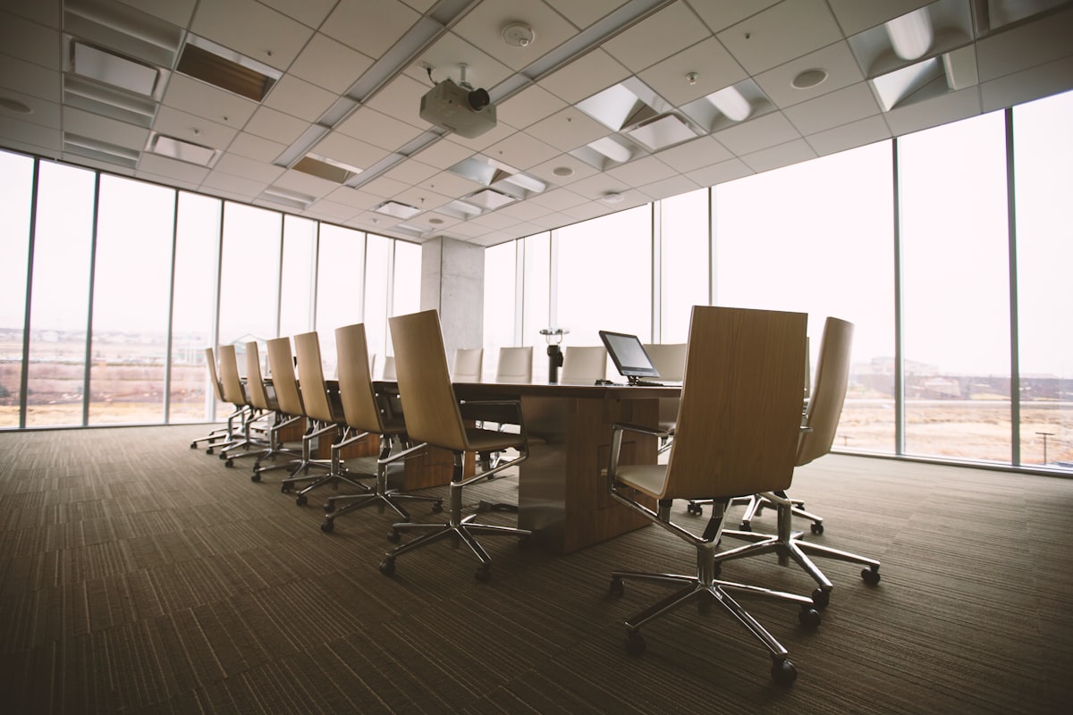 Empty boardroom table prepared for a strategy meeting