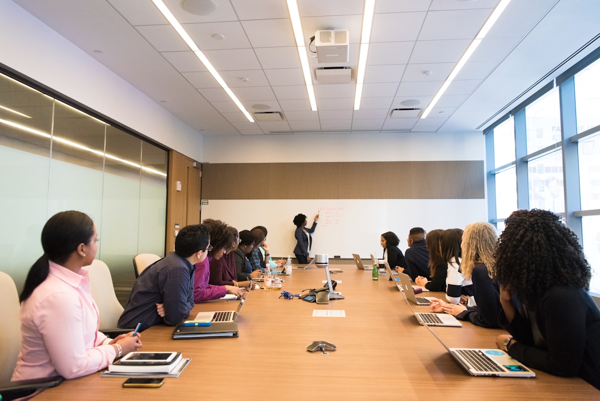 Partners discussing investment strategy around a conference table