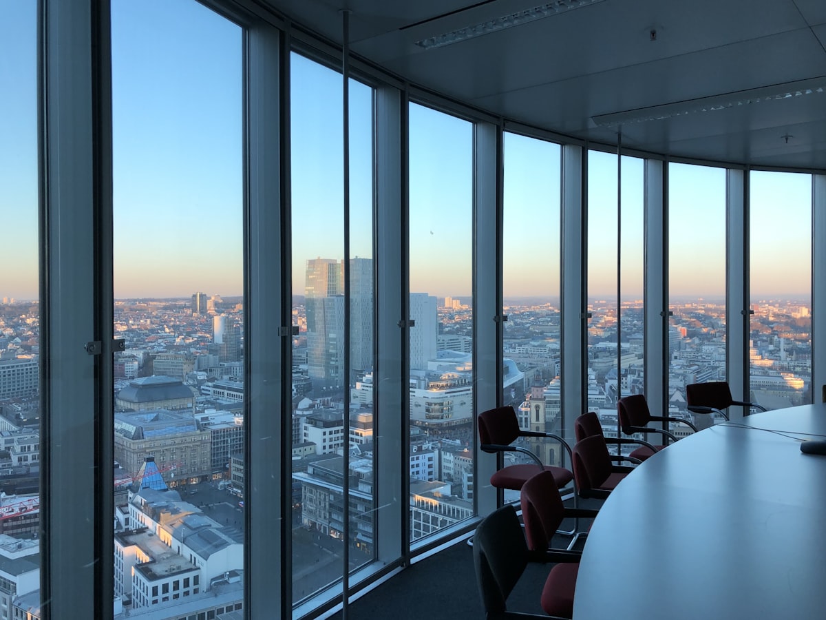 Team collaborating near a glass office window